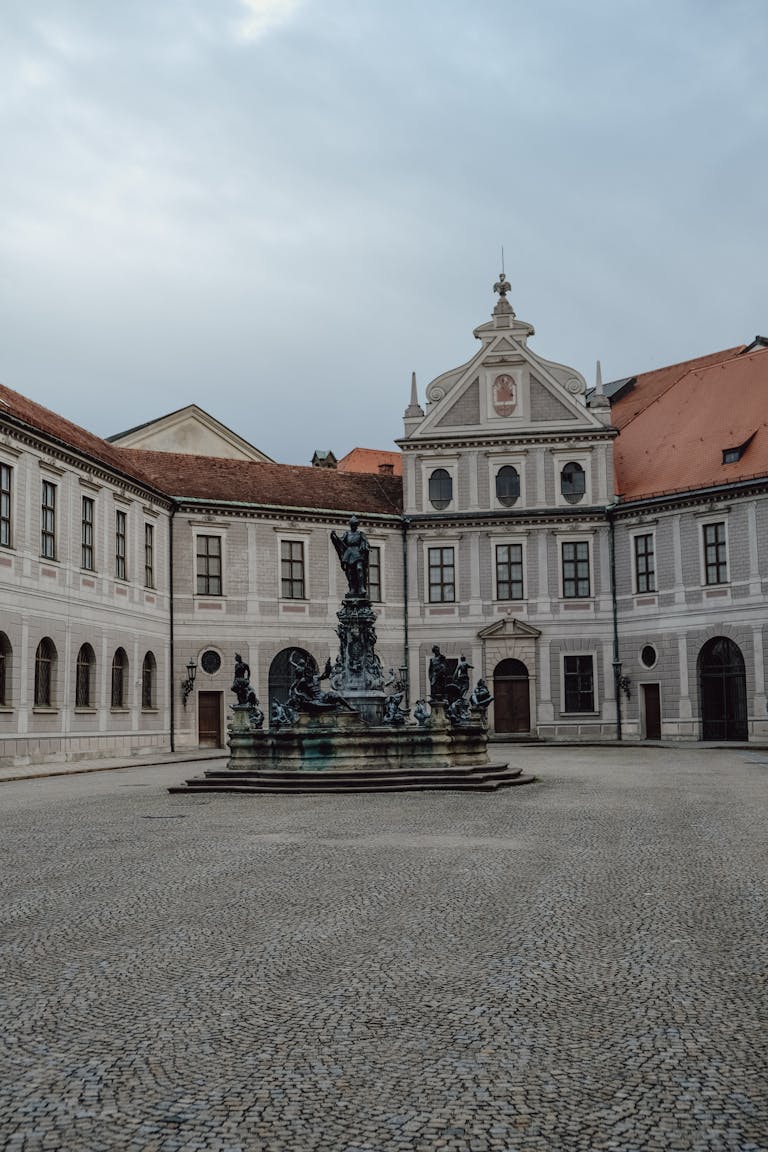 Explore the architectural beauty of the Münchner Residenz courtyard with its ornate fountain.