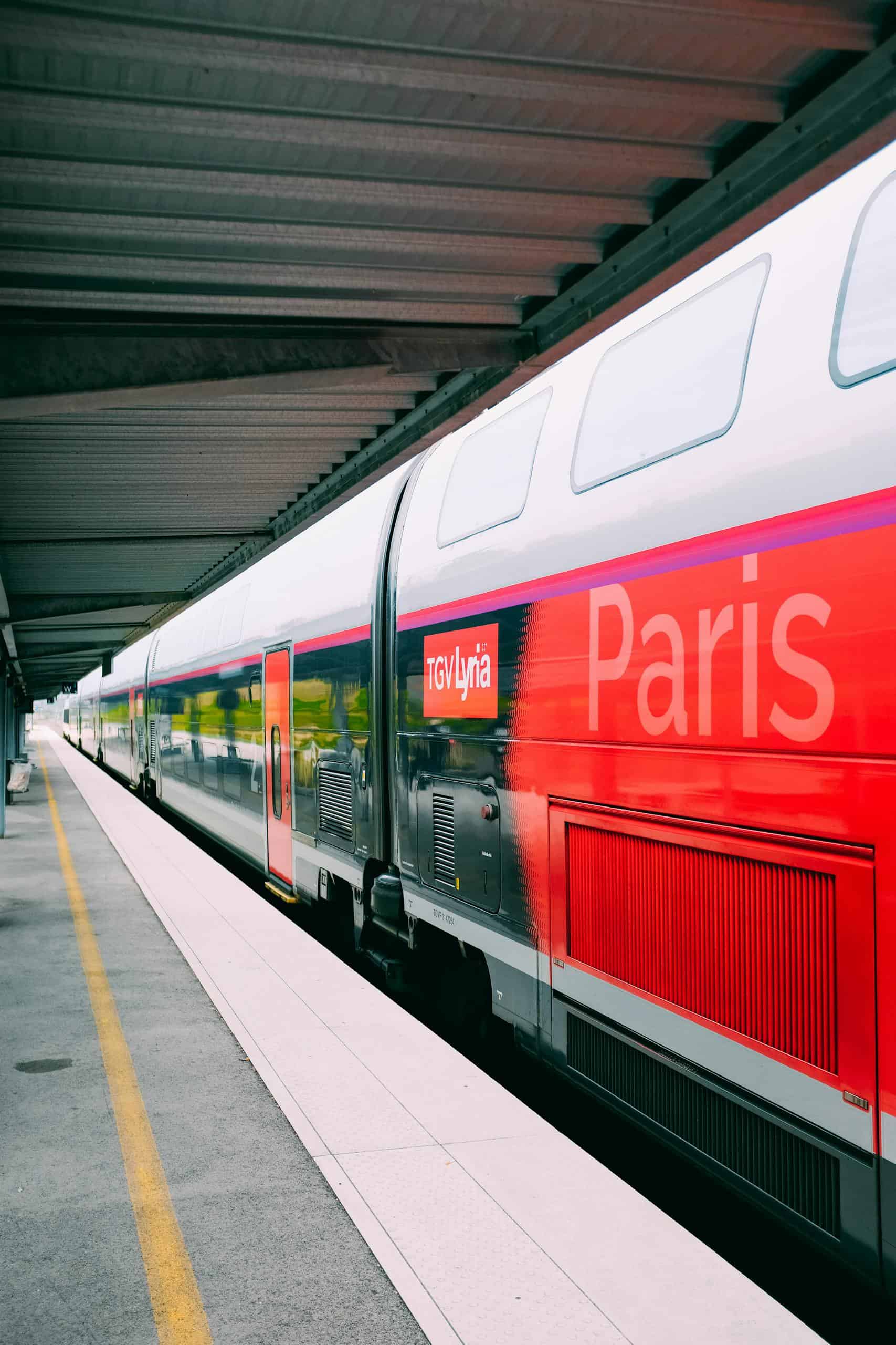 A sleek TGV train at a Paris railway station, showcasing modern design in public transportation.