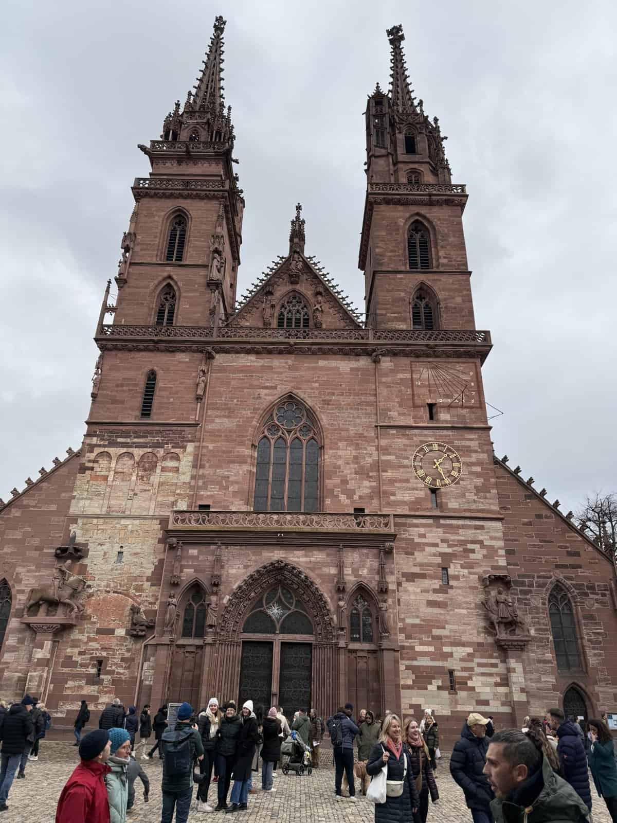 Facade of Basel Minster overlooking Münsterplatz during the Christmas season