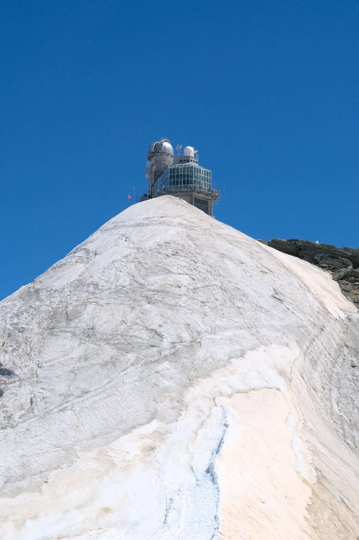 Jungfraujoch observatory on the “Top of Europe” with snowy Alpine peaks in Switzerland, discounted with the Swiss Travel Pass