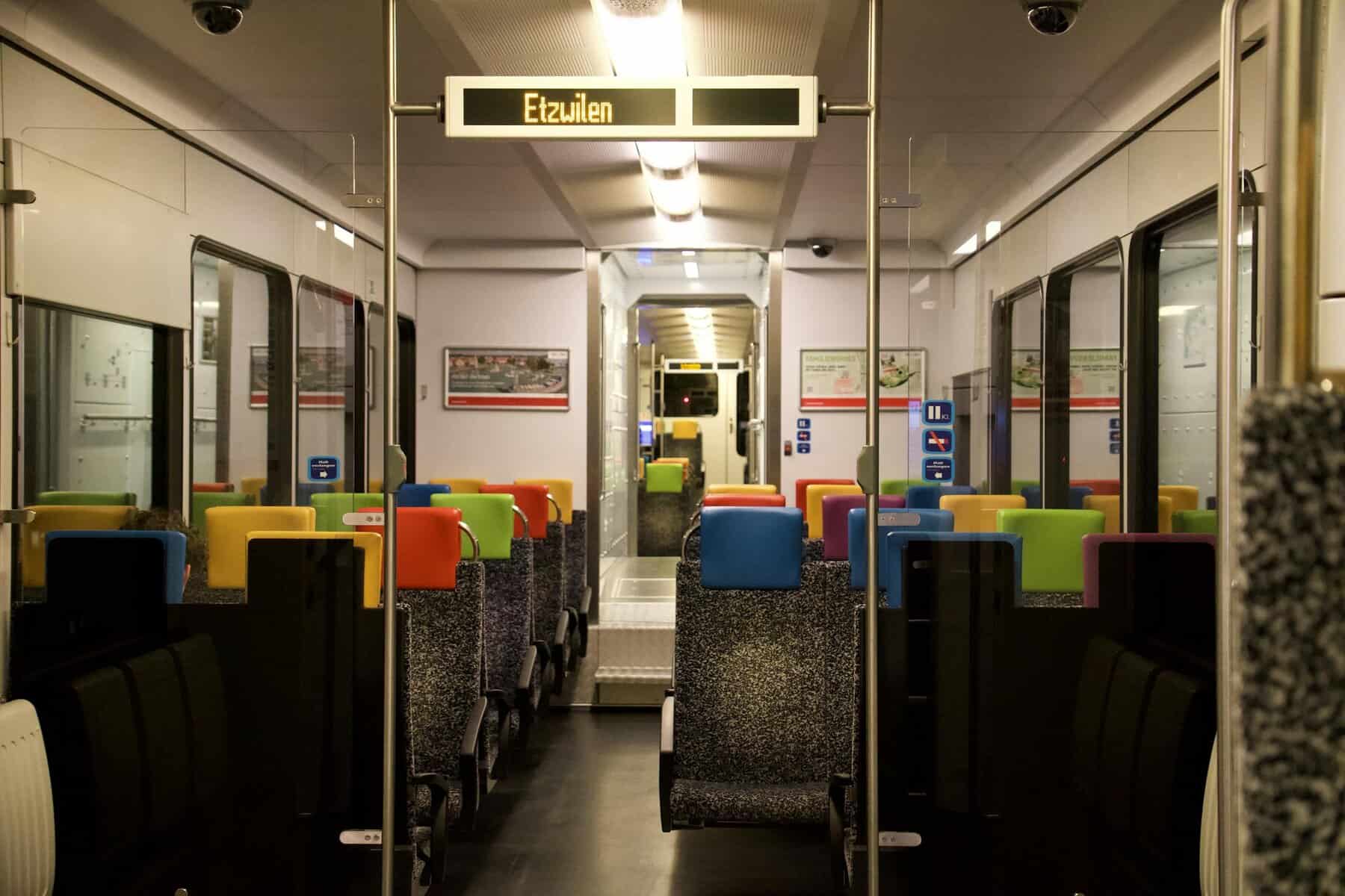 Vibrant seats inside a modern Swiss train in Etzwilen, Switzerland.