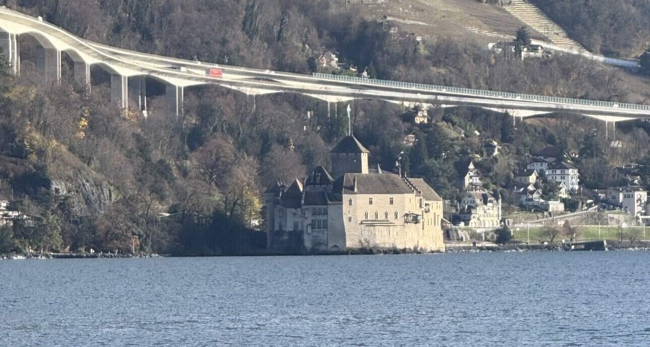 Château de Chillon on Lake Geneva near Montreux with mountains and vineyards in the background
