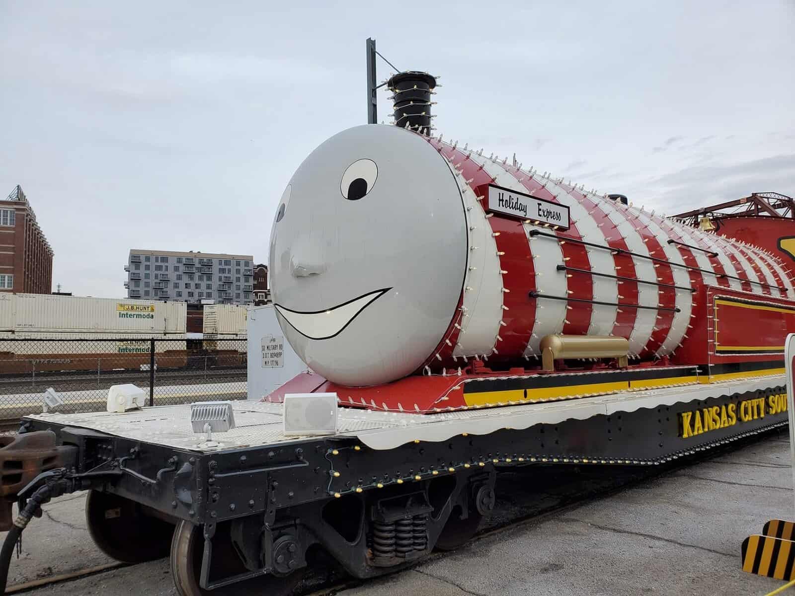 Kansas City Holiday Express train decorated for Christmas with festive red and white engine display