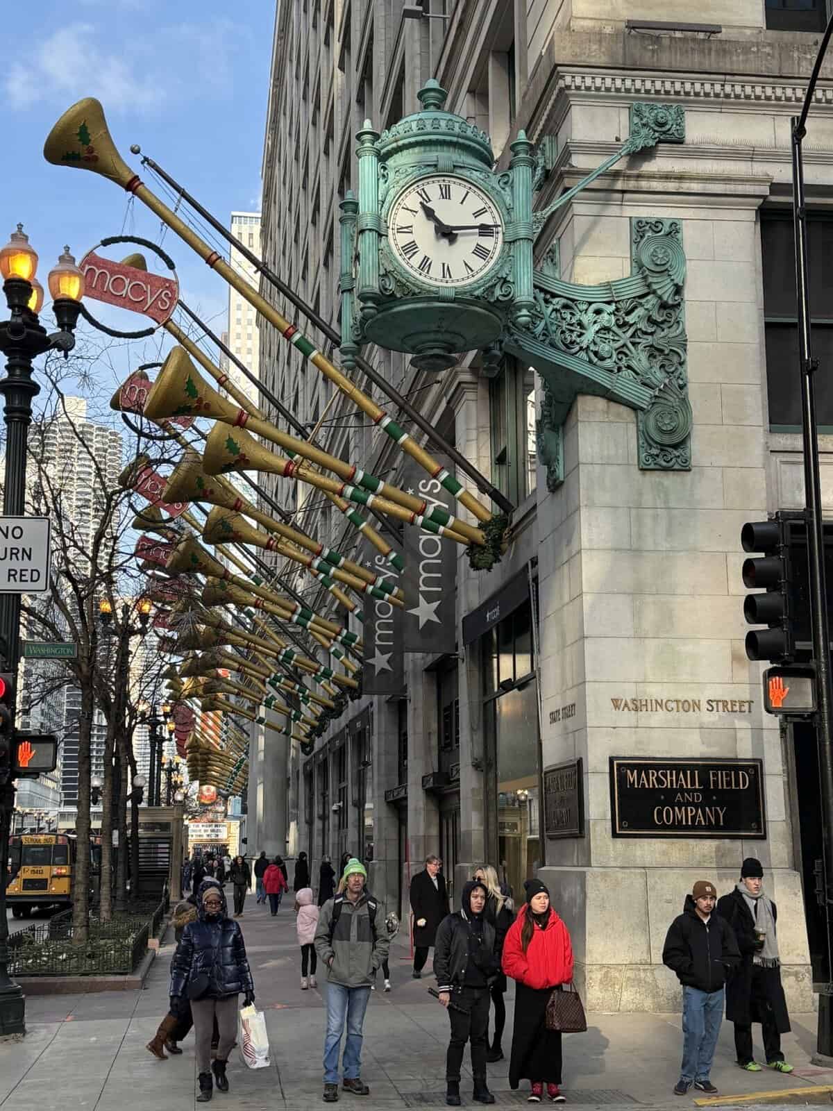 Marshall Field and Company building now Macy’s decorated for Christmas along State and Washington Streets
