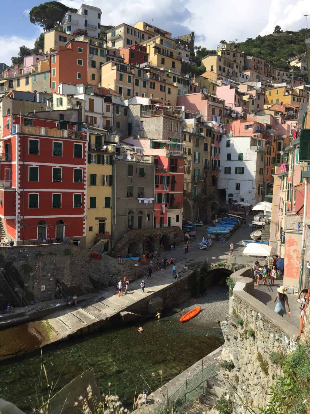 Colorful buildings in Riomaggiore Cinque Terre overlooking the small harbor and marina