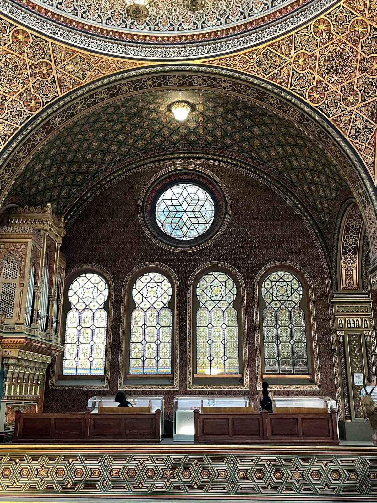 Detailed view of the ornate ceiling and stained glass windows in the Spanish Synagogue, Prague.