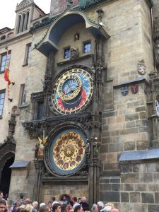 Prague Astronomical Clock on Old Town Hall with crowds watching the famous medieval clock.