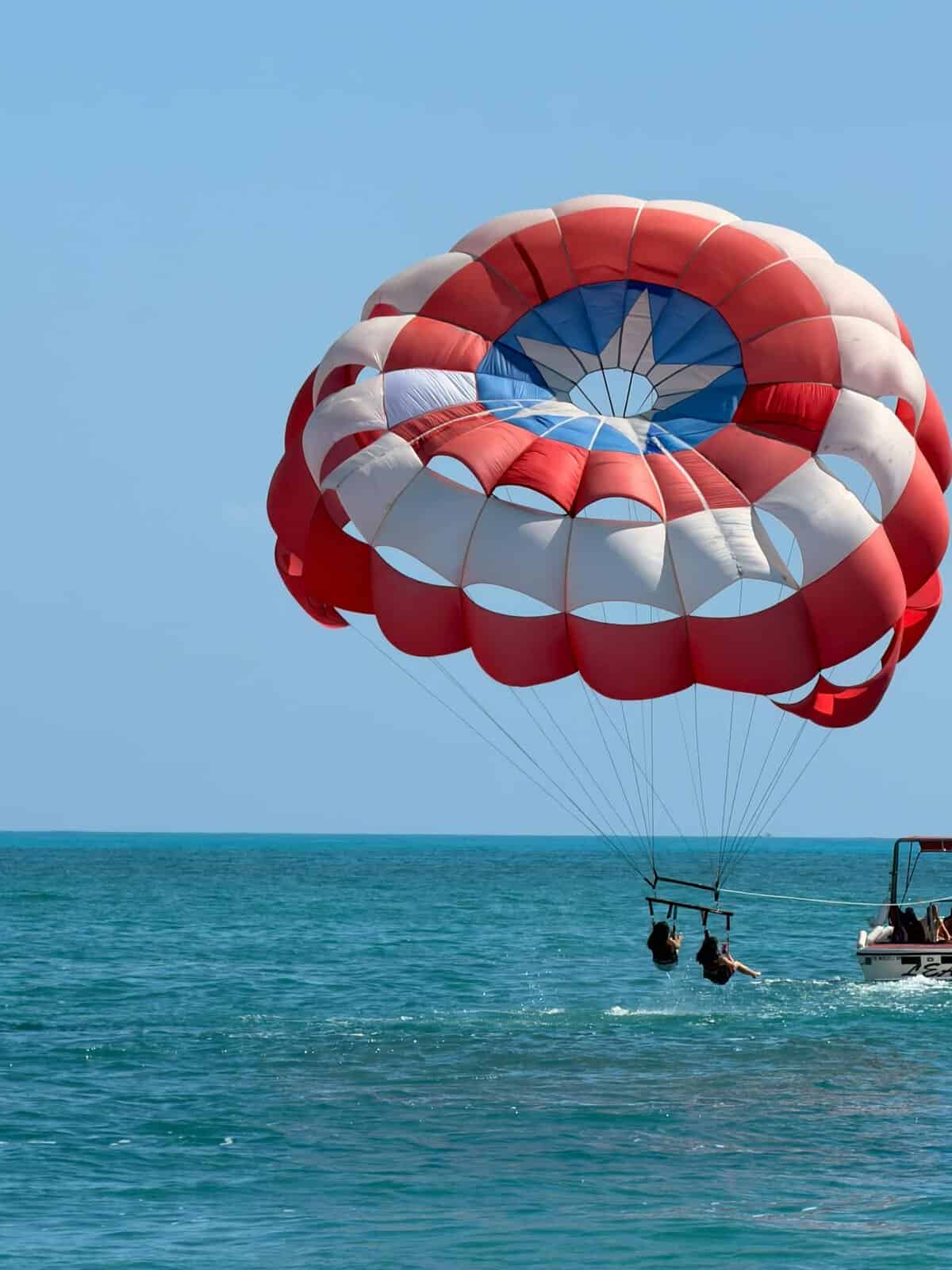 Experience parasailing. A thrilling adventure with scenic ocean views.