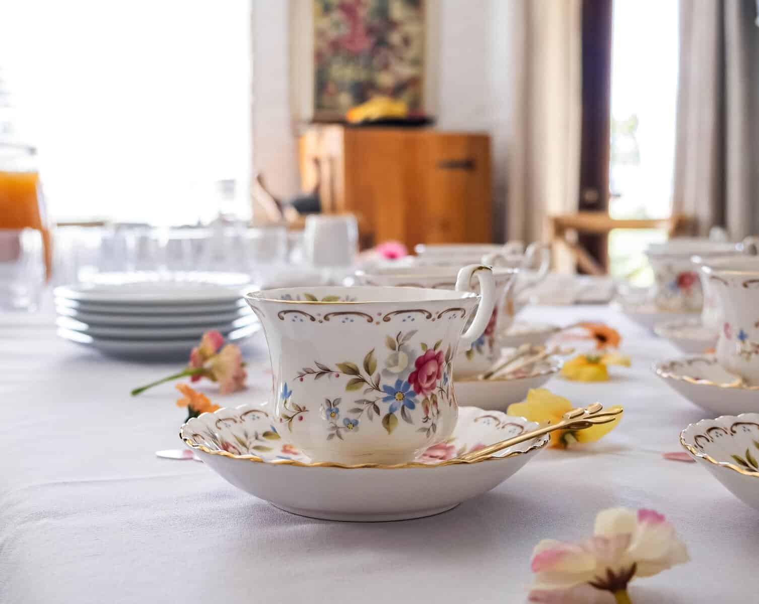 Charming porcelain tea set with floral patterns arranged elegantly on a table.