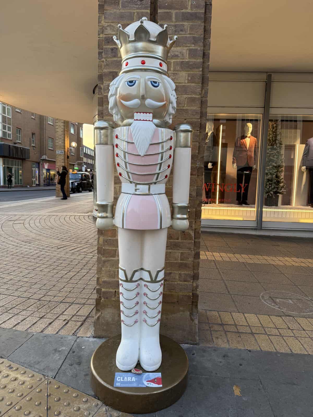 Large decorative nutcracker statue displayed in Kingston Upon Thames during the Christmas season