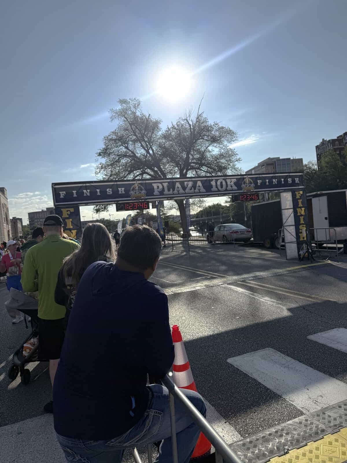Runners and spectators gathered near the Plaza 10K finish line in Kansas City on a sunny race day.