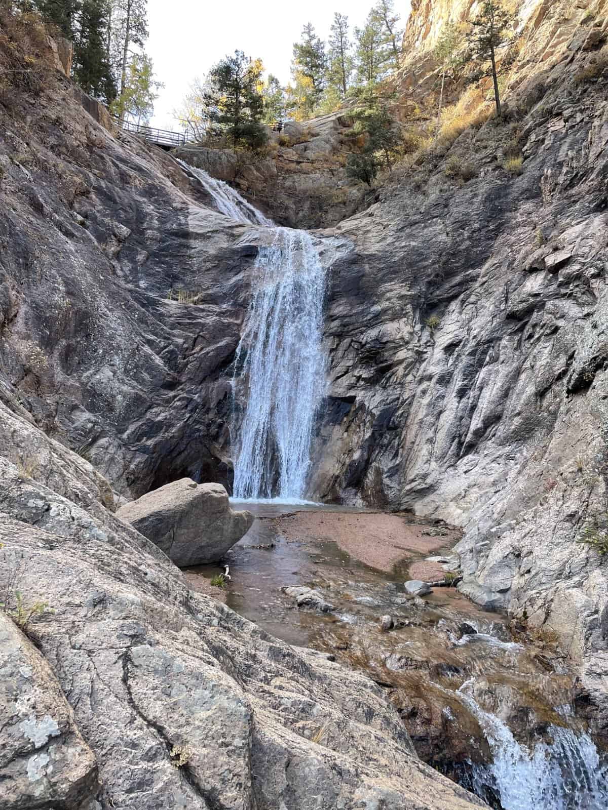 View of Seven Falls cascading down a rocky canyon wall in Colorado Springs, Colorado.