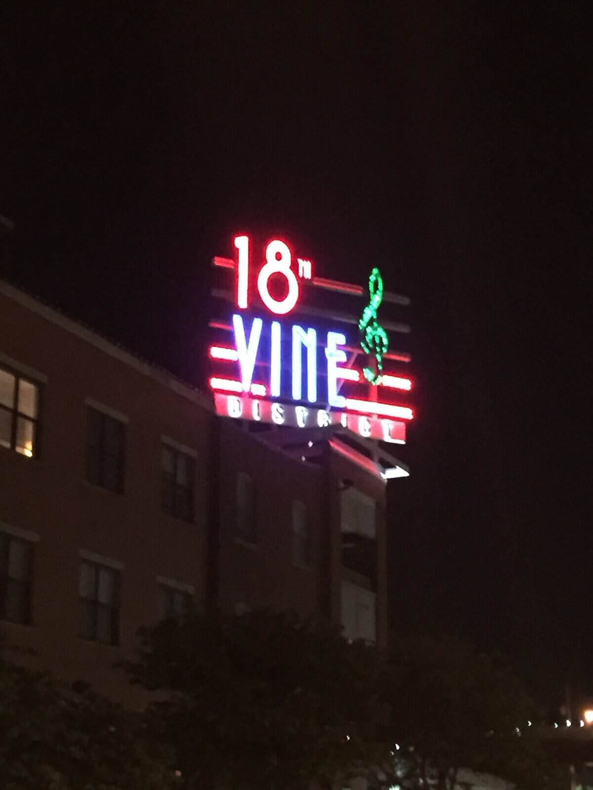 Neon 18th and Vine District sign at night in Kansas City