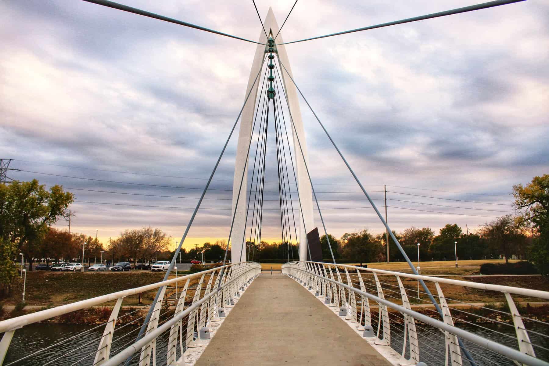 Pedestrian bridge over the Arkansas River in Wichita, Kansas at sunset
