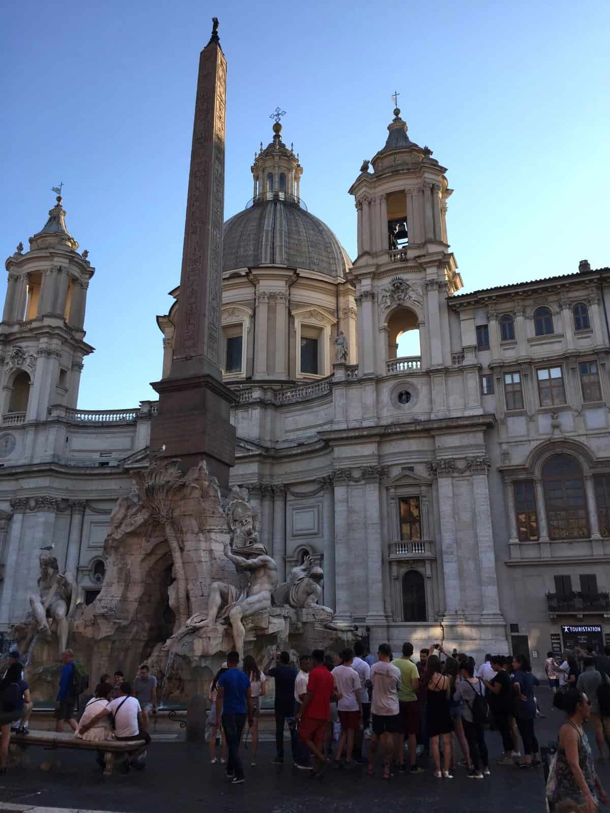 Piazza Navona in Rome with an Egyptian obelisk, fountain, and historic church