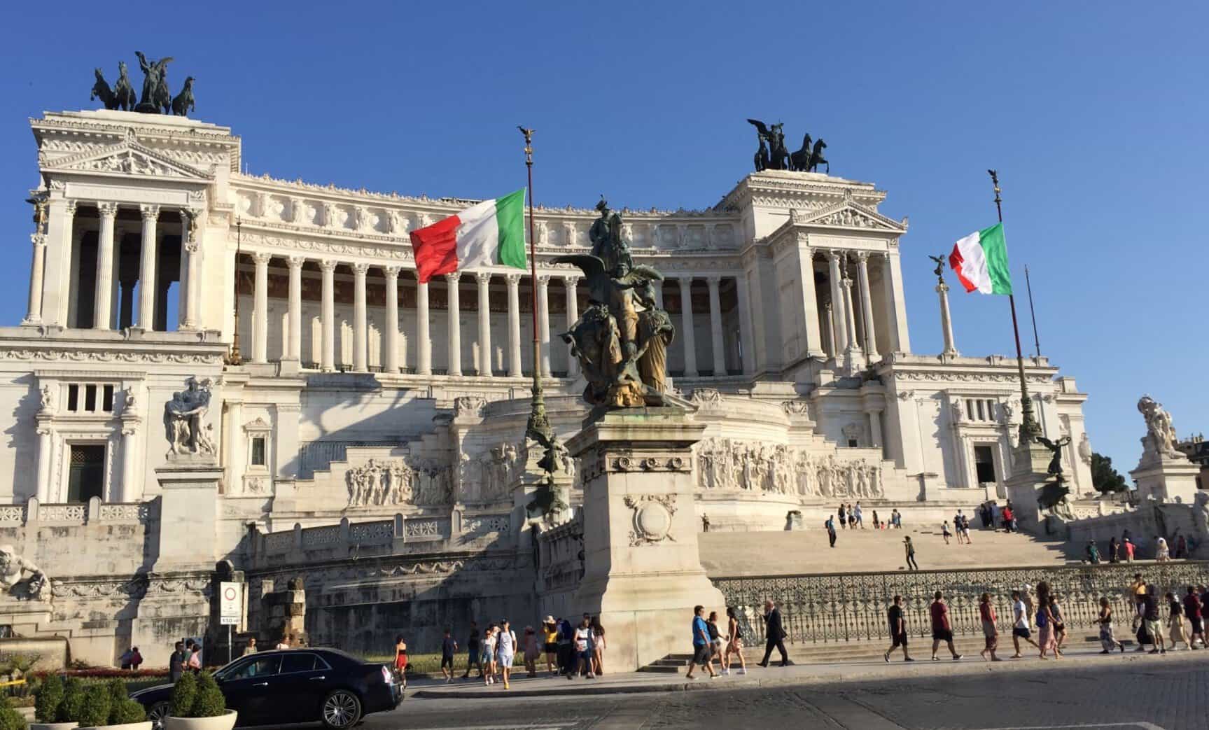 Victor Emmanuel II Monument in Piazza Venezia in Rome with Italian flags flying in front